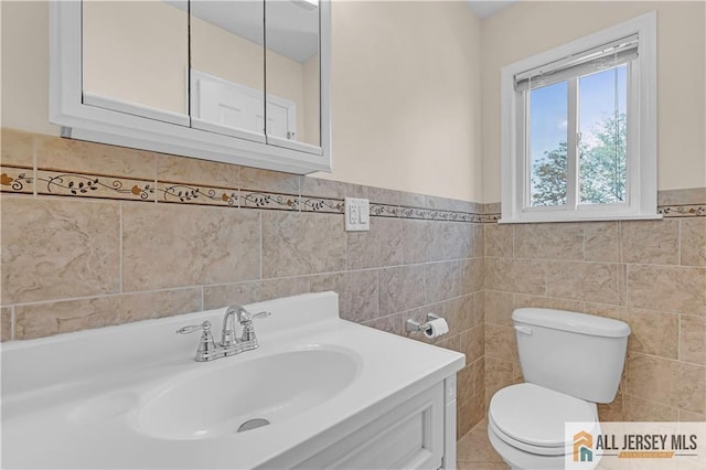 2507 Balmoral Ct, Hillsborough, NJ 08844 - bathroom featuring vanity, tile walls, and wainscoting