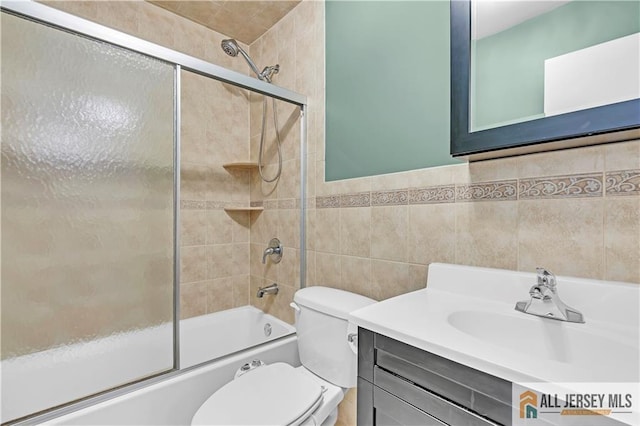2507 Balmoral Ct, Hillsborough, NJ 08844 - full bathroom with combined bath / shower with glass door, vanity, and tile walls