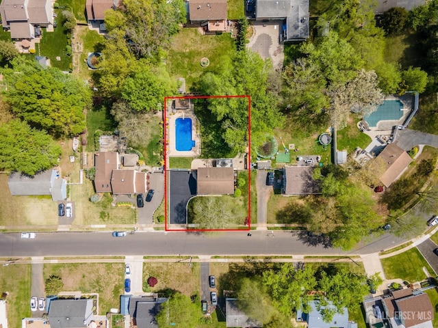 aerial view of residential area with a pool area and property boundaries highlighted