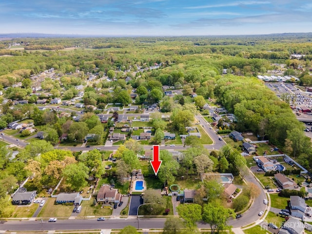 aerial overview of property's location with a forest