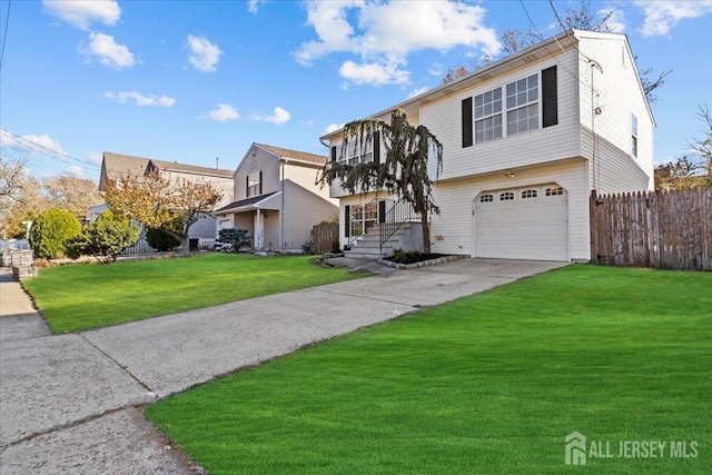 view of front of home featuring a front lawn and a garage