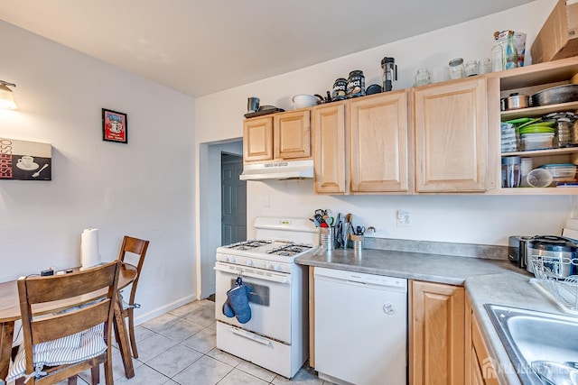 kitchen with sink, light brown cabinets, white appliances, and light tile patterned floors