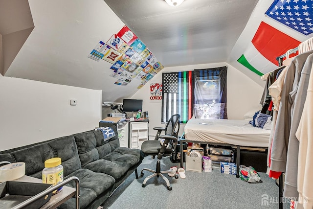 bedroom featuring lofted ceiling and carpet flooring