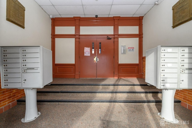434 Lawrence St Unit 12, Perth Amboy, NJ 08861 - surrounding community featuring a paneled ceiling, mail area, and wainscoting
