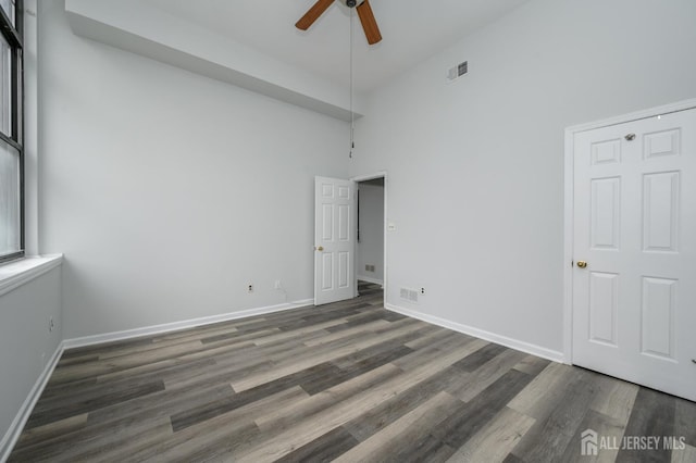 434 Lawrence St Unit 12, Perth Amboy, NJ 08861 - unfurnished bedroom with high vaulted ceiling, wood finished floors, and ceiling fan