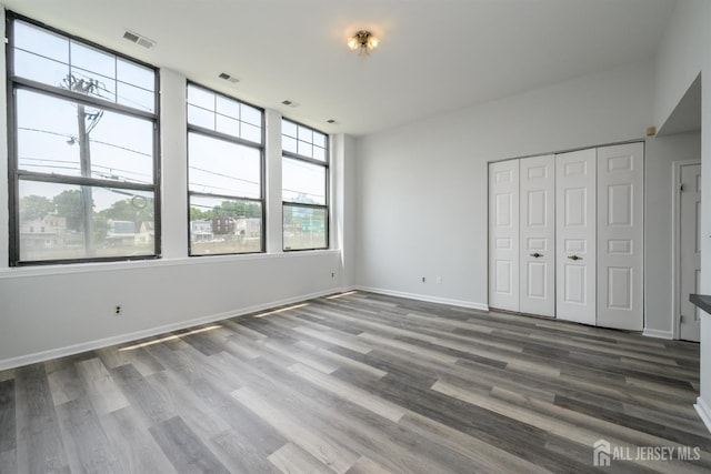 434 Lawrence St Unit 12, Perth Amboy, NJ 08861 - unfurnished bedroom featuring wood finished floors and a closet