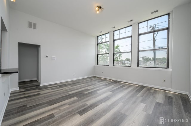 434 Lawrence St Unit 12, Perth Amboy, NJ 08861 - unfurnished room with dark wood-style floors
