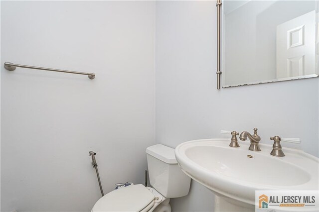 bathroom with sink and toilet