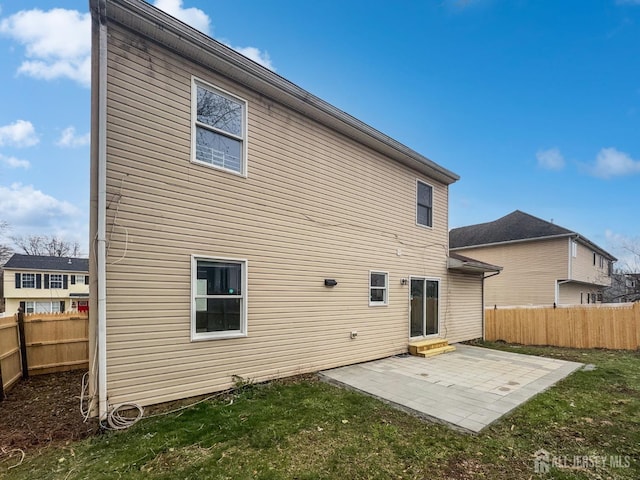 rear view of property featuring a patio