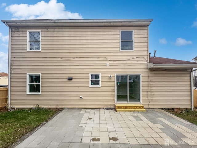 rear view of house with a patio and entry steps
