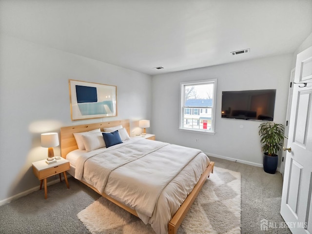 carpeted bedroom featuring baseboards