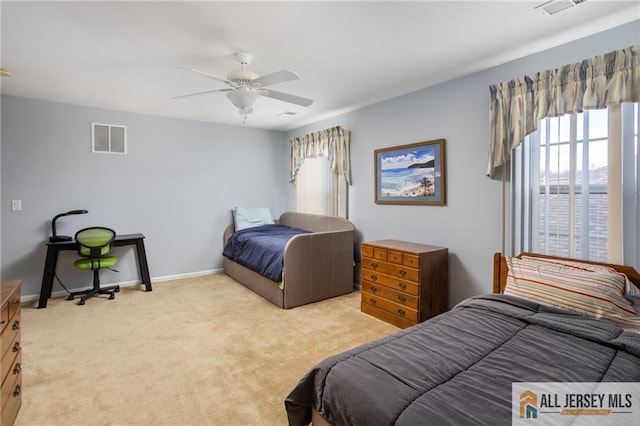 bedroom featuring ceiling fan, carpet, visible vents, and baseboards