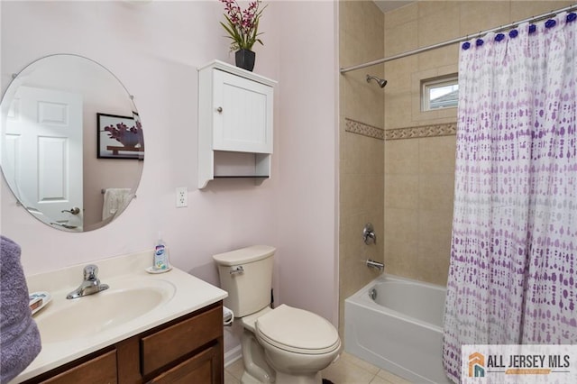 bathroom with tile patterned floors, vanity, toilet, and shower / bath combo with shower curtain