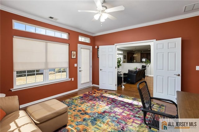 office with ornamental molding, wood finished floors, and visible vents