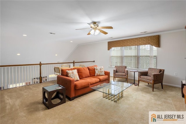 living room featuring visible vents, baseboards, ceiling fan, ornamental molding, and carpet floors