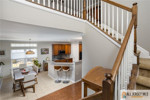 interior space featuring baseboards and tile patterned floors