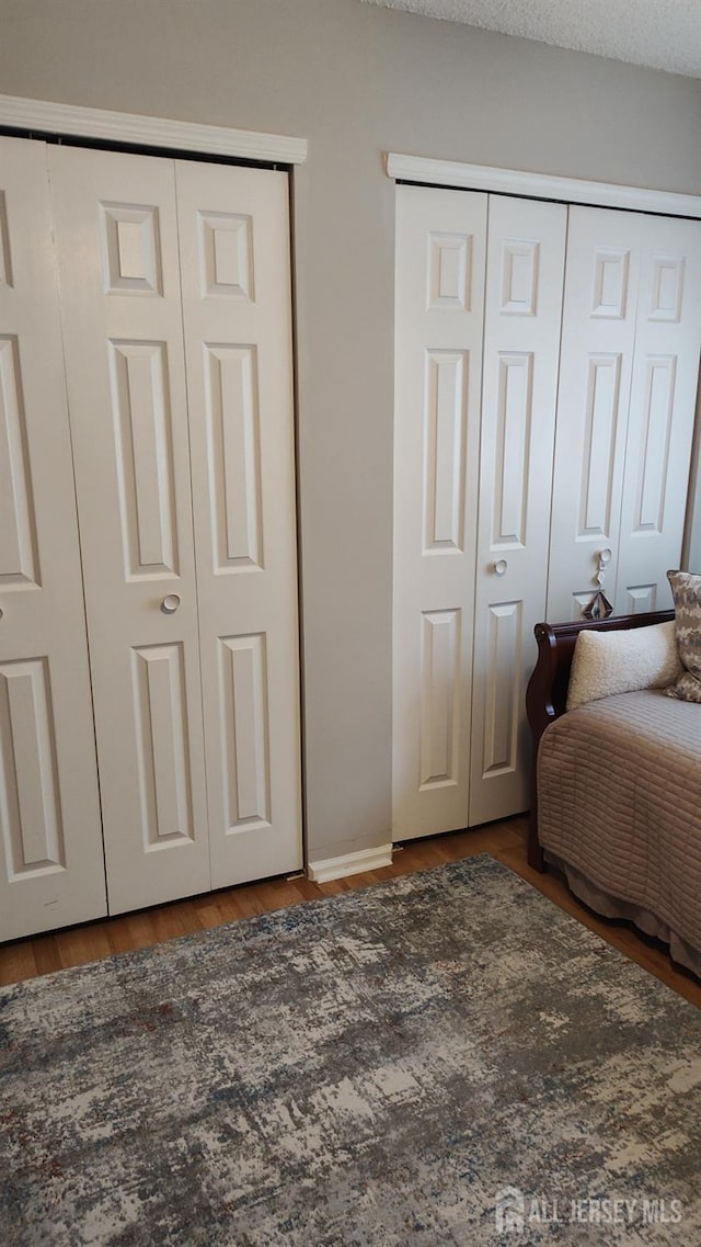 90 Clay St, North Brunswick, NJ 08902 - bedroom with multiple closets and wood finished floors