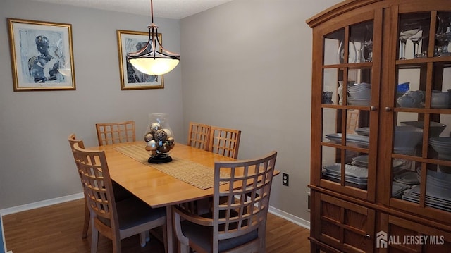 90 Clay St, North Brunswick, NJ 08902 - dining room featuring dark wood-style floors and baseboards