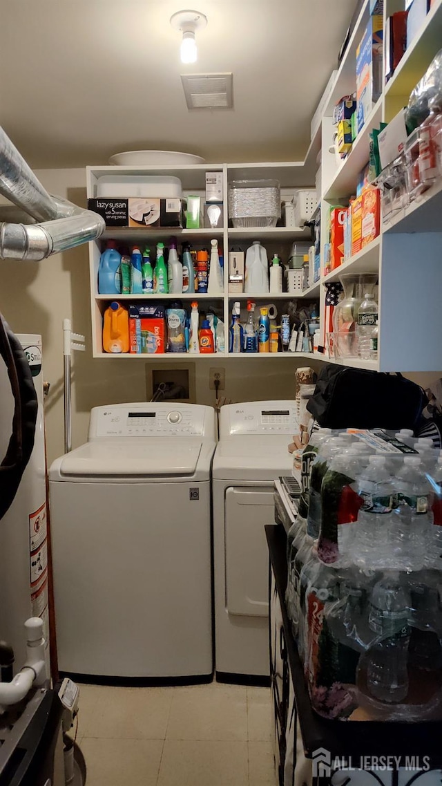 90 Clay St, North Brunswick, NJ 08902 - laundry room featuring separate washer and dryer and light tile patterned floors