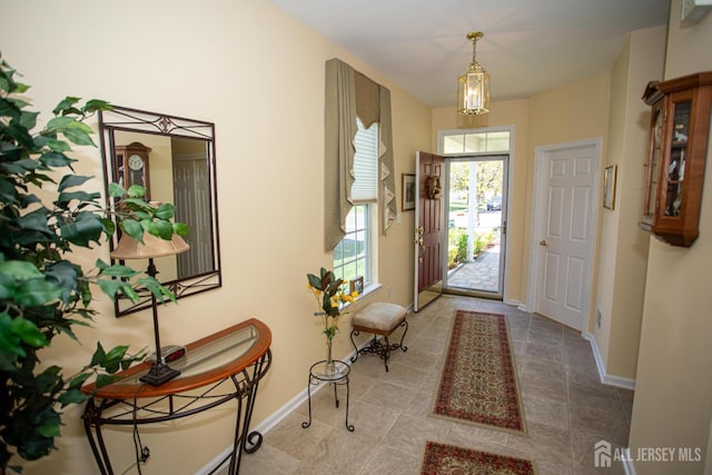 tiled entryway with baseboards