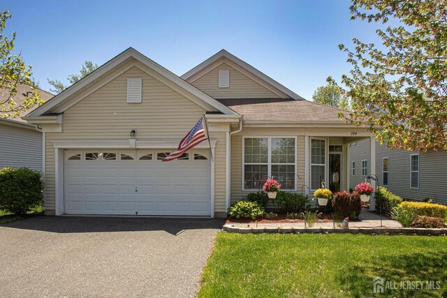 104 Prusakowski Blvd, Sayreville, NJ 08859 - ranch-style home with driveway, a garage, a front yard, and roof with shingles