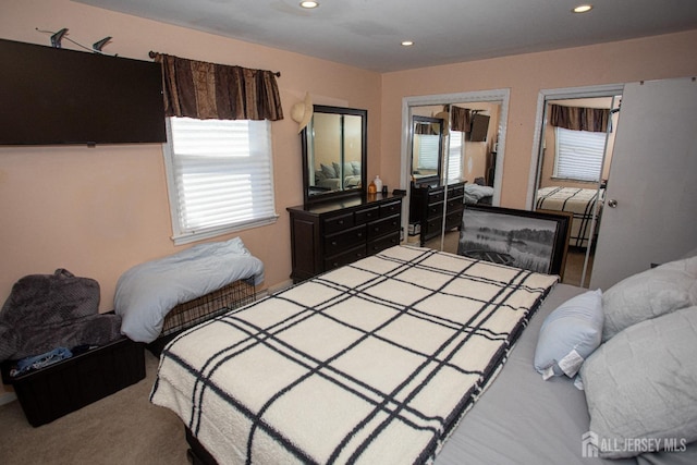 carpeted bedroom with recessed lighting