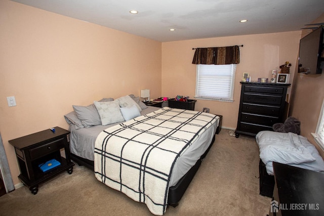 carpeted bedroom with recessed lighting