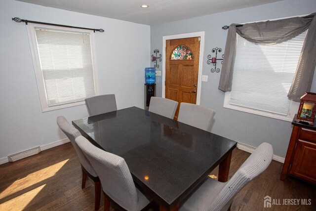 dining room featuring dark hardwood / wood-style floors and a wealth of natural light