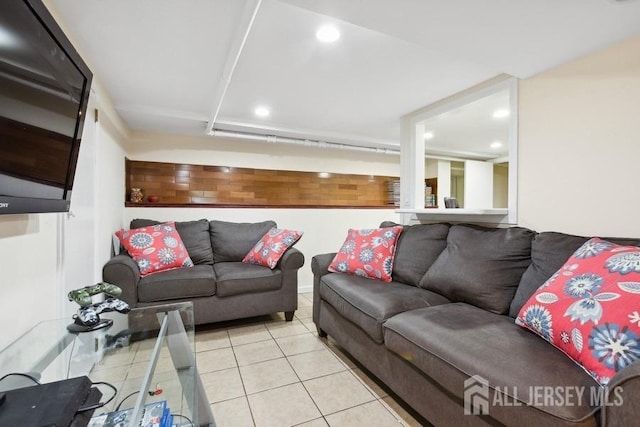 living room with light tile patterned floors and recessed lighting