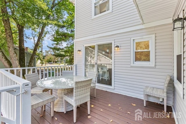 deck featuring outdoor dining area