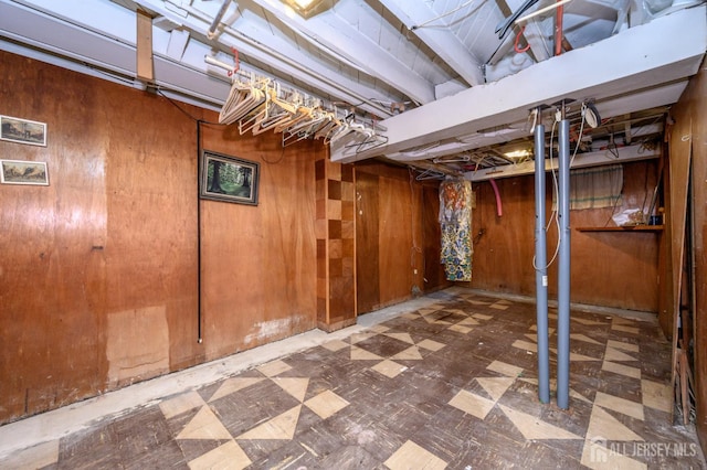 958 Apgar Ter, Rahway, NJ 07065 - unfinished basement featuring tile patterned floors and wooden walls
