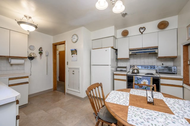 958 Apgar Ter, Rahway, NJ 07065 - kitchen with electric range oven, freestanding refrigerator, exhaust hood, light countertops, and backsplash