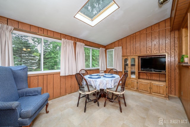 958 Apgar Ter, Rahway, NJ 07065 - dining room with wood walls, healthy amount of natural light, a skylight, and lofted ceiling