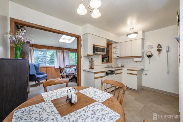 958 Apgar Ter, Rahway, NJ 07065 - dining area with a skylight and a chandelier