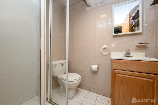 958 Apgar Ter, Rahway, NJ 07065 - bathroom featuring tile walls, vanity, a stall shower, and tile patterned flooring