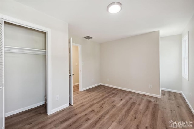 763 Prospect Ave, Old Bridge, NJ 08879 - unfurnished bedroom featuring wood finished floors and a closet