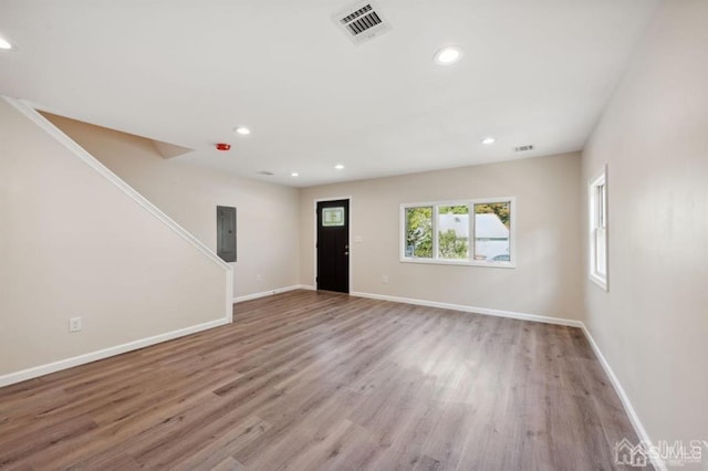 763 Prospect Ave, Old Bridge, NJ 08879 - foyer entrance featuring electric panel, wood finished floors, stairway, and recessed lighting