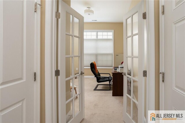 office featuring light carpet and french doors