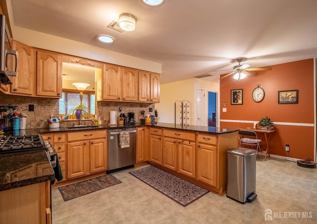11 Drexel Ter, Monroe, NJ 08831 - kitchen featuring appliances with stainless steel finishes, a peninsula, ceiling fan, and backsplash