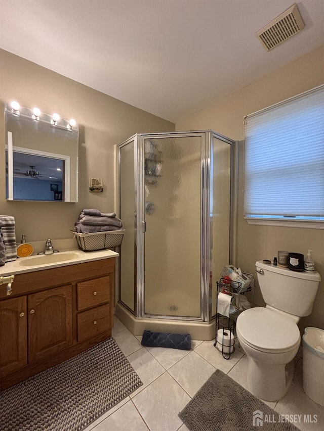 11 Drexel Ter, Monroe, NJ 08831 - bathroom with vanity, tile patterned floors, a stall shower, toilet, and vaulted ceiling