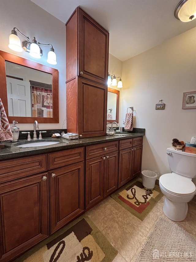 11 Drexel Ter, Monroe, NJ 08831 - bathroom featuring double vanity, toilet, and tile patterned flooring