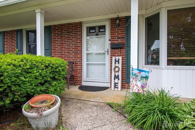 11 Drexel Ter, Monroe, NJ 08831 - doorway to property featuring brick siding and covered porch