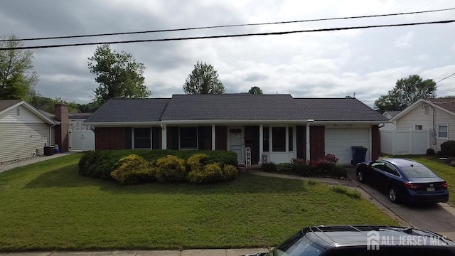 11 Drexel Ter, Monroe, NJ 08831 - ranch-style house with an attached garage, brick siding, and concrete driveway