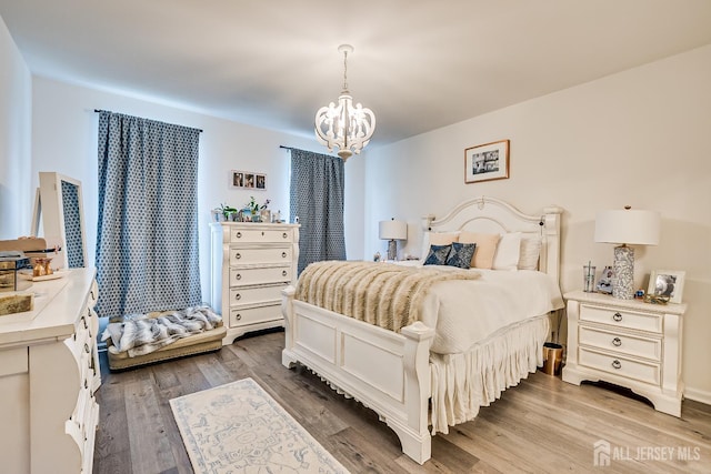 224 Park Ln, Dunellen, NJ 08812 - bedroom with a chandelier and wood finished floors