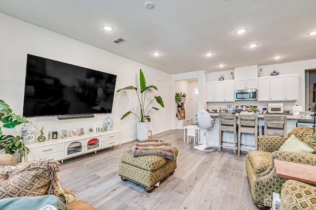 224 Park Ln, Dunellen, NJ 08812 - living area with light wood-style flooring, recessed lighting, and baseboards