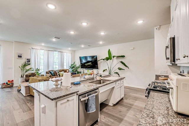 224 Park Ln, Dunellen, NJ 08812 - kitchen featuring stainless steel appliances, open floor plan, a sink, a kitchen island with sink, and recessed lighting