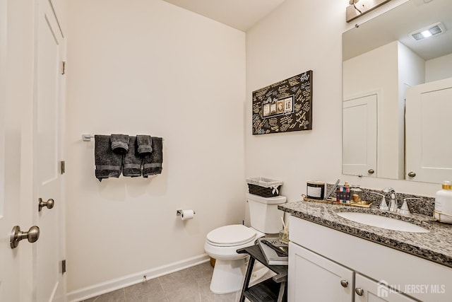 224 Park Ln, Dunellen, NJ 08812 - bathroom with vanity, baseboards, toilet, and tile patterned flooring