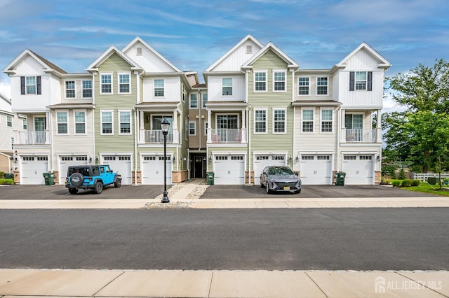 224 Park Ln, Dunellen, NJ 08812 - multi unit property featuring board and batten siding, an attached garage, and driveway