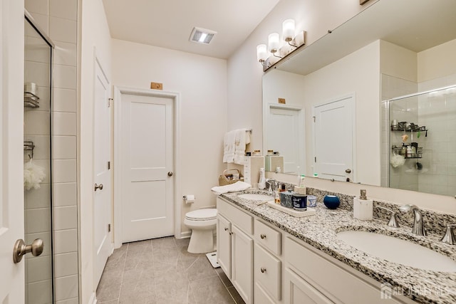 224 Park Ln, Dunellen, NJ 08812 - bathroom with double vanity, a shower stall, toilet, and tile patterned flooring