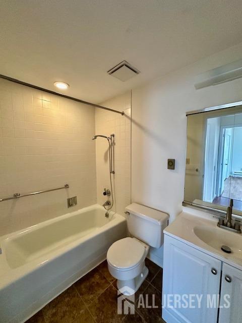 bathroom featuring visible vents, toilet, tile patterned flooring, vanity, and shower / bathing tub combination